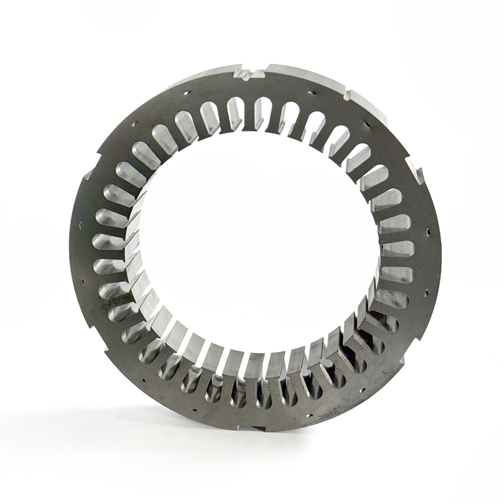 What is the process of laminating the stator and rotor cores?